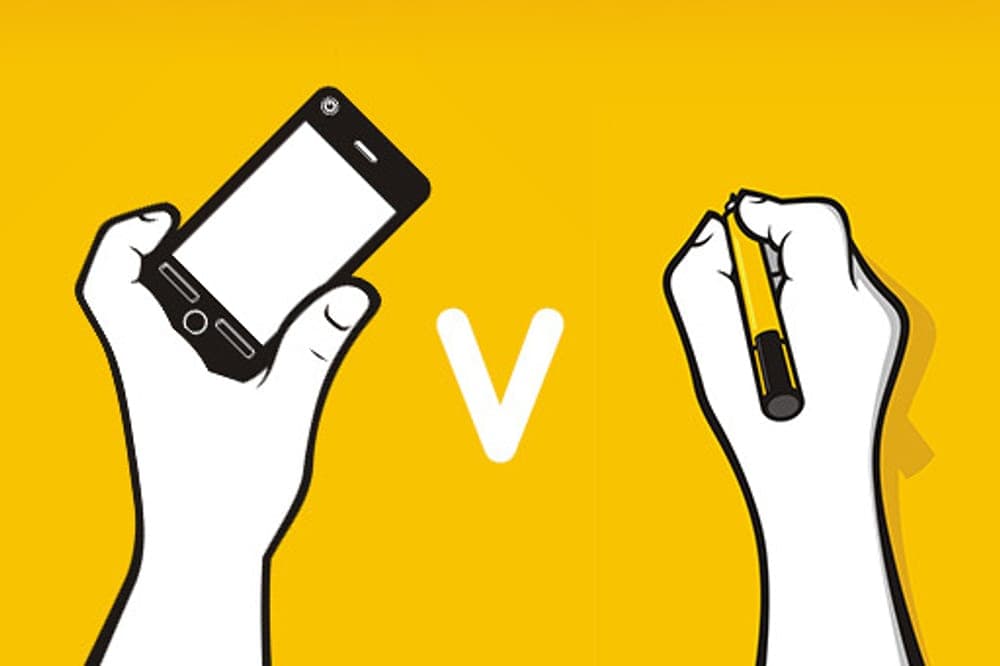 A hand holding a smartphone and a hand holding a pencil, with a ‘V’ in between them.