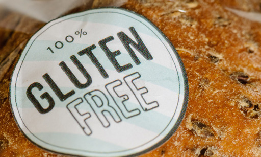 An artisan loaf with a ‘100% Gluten free’ sticker on it.
