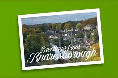 A Postcard with a rail bridge over a river, saying ‘Greetings from Knaresborough’.