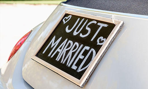 A car with a ‘Just married’ sign on the back.