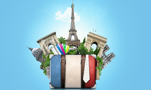 A suitcase painted in blue, white and red, like the French flag, with various Parisian landmarks, such as the Eiffel Tower, popping out of it.